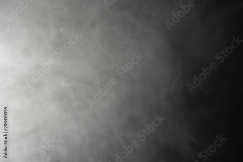 Thick white smoke on a black background.
