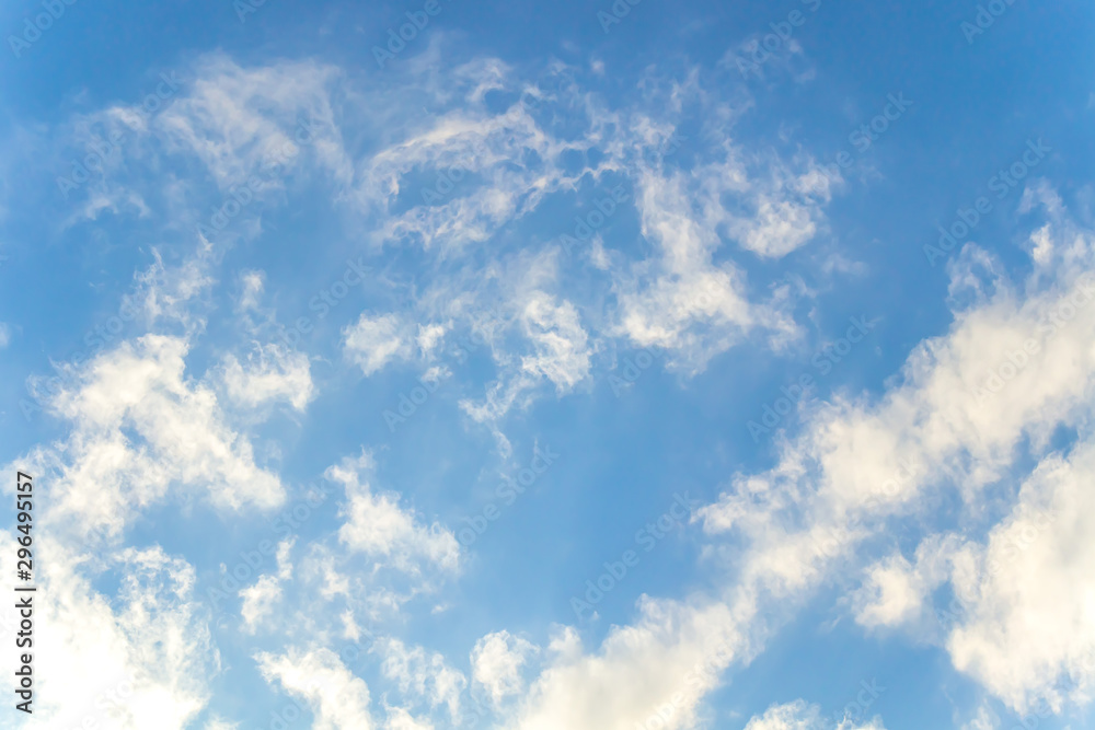 White clouds on a blue sky as a background for design White clouds on a blue sky as a background for design