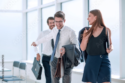 young employees leaving the office at the end of the working day
