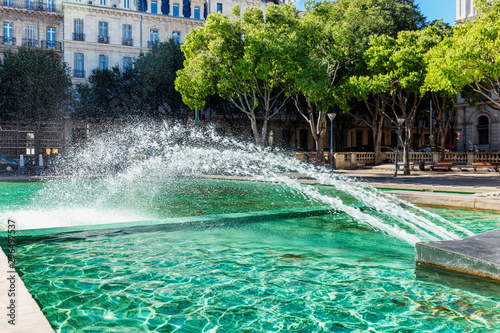 Fountain on the square in Marseille. Beautiful view. Postcard.