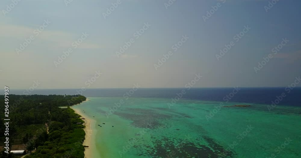 Aerial rising shot. Relaxing, turquoise water. Tropical island. Bora Bora. Calm, chilled. Aerial rising shot. Relaxing, turquoise water. Tropical island. Bora Bora. Calm, chilled.