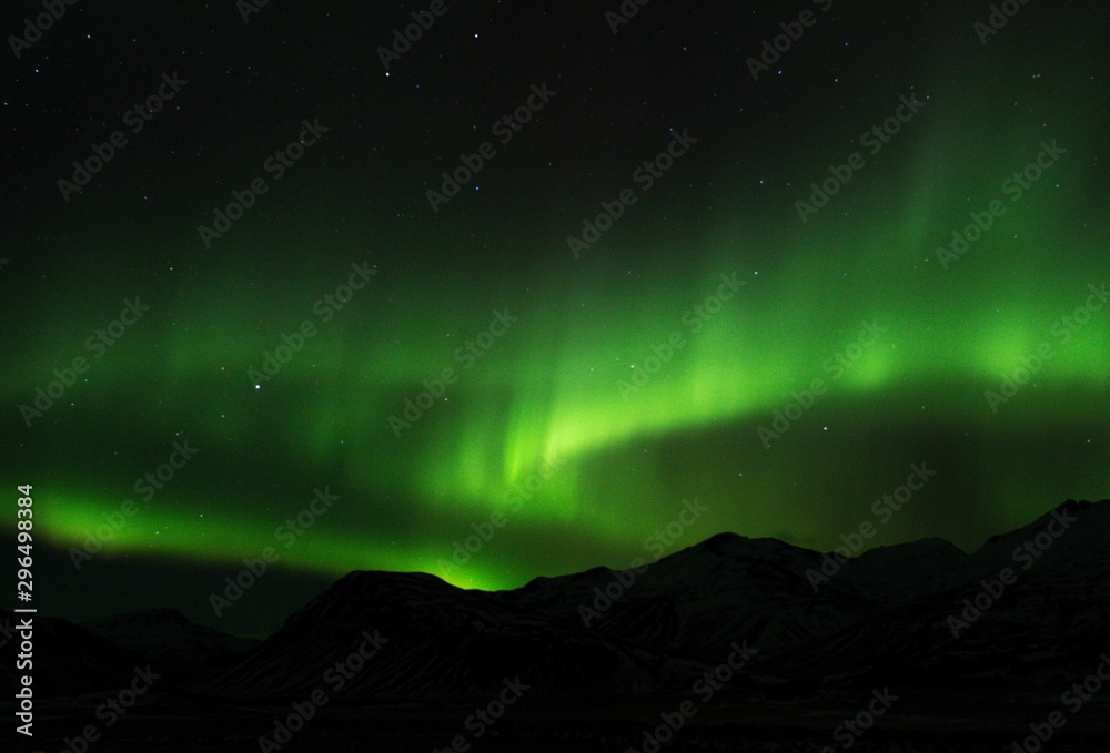 Green aurora borealis on Iceland night sky Green aurora borealis on Iceland night sky
