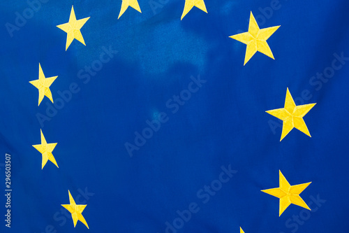 Political relationships. Flag of European Union. Close-up with yellow stars and blue color.