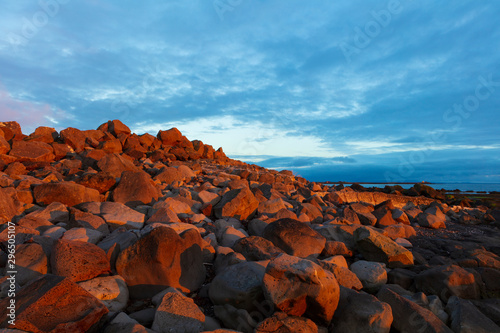 A landscape around sunset of the Atlantic Coast, photographed near the Grotta Island Lighthouse, Reykjavik, Iceland.