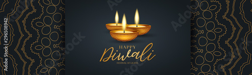 Happy Diwali - festival of lights banner or website header design. Indian traditional holiday background with Diya oil lamp and text typography on a black backdrop with golden hindu ornament.