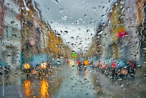 Fototapeta Car driving in rain and storm abstract background