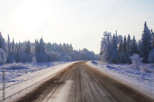 Winter road and forest. Beautiful landscape. Background.