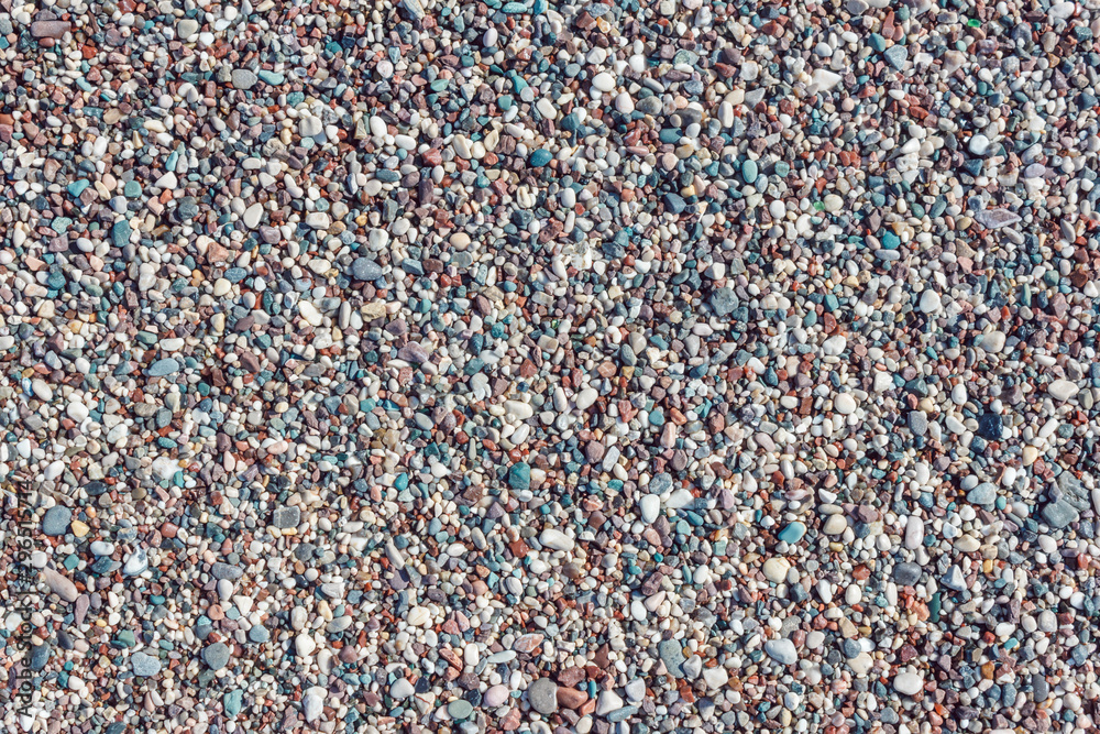Fototapeta premium Multicolored texture of beach pebbles. Natural rocks background