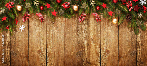 Christmas wooden banner with decoration and fir tree. View with copy space.