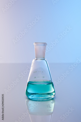 glass flask with blue colorful liquid