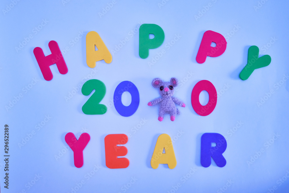 Naklejka premium Text, Happy year 2020 , multicolored letters on a blue background. Happy new year