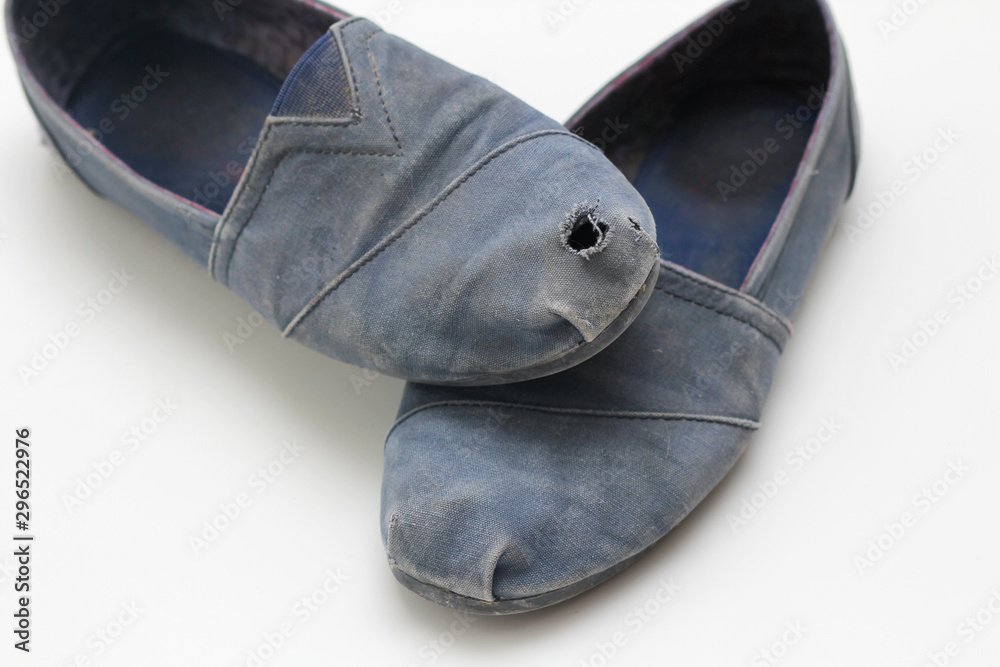 Old dirty rag boots with a hole. White background. Waste recycle ...
