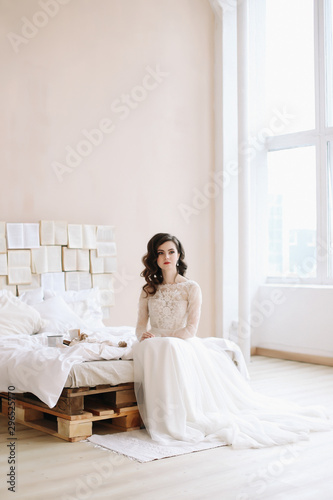 Bride in lingerie. Morning wedding gatherings. tenderness concept. Elegant classic wedding dress. 