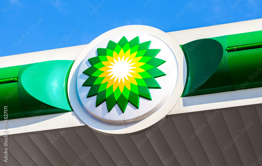 BP - British Petroleum petrol station logo over blue sky Stock Photo