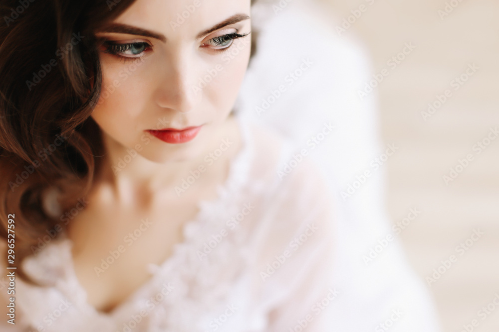 Bride in lingerie. Morning wedding gatherings. tenderness concept. Elegant classic wedding dress. Bride in lingerie. Morning wedding gatherings. tenderness concept. Elegant classic wedding dress.
