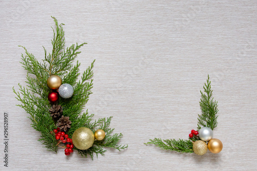 Christmas wooden background with fir branches and balls. New Year's decoration.