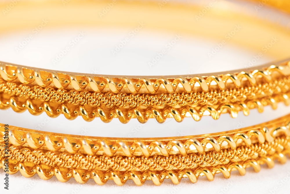 Gold bangles isolated on white background - wedding / Traditional gold bangles Gold bangles isolated on white background - wedding / Traditional gold bangles