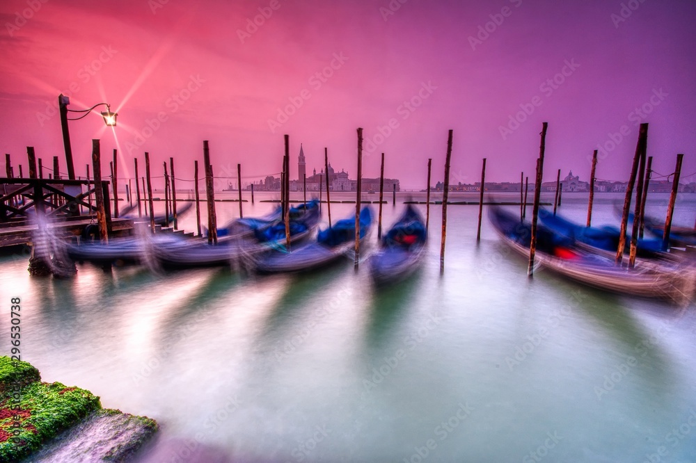 Gondolas moored by Saint Mark square, Venice, Italy, Europe.