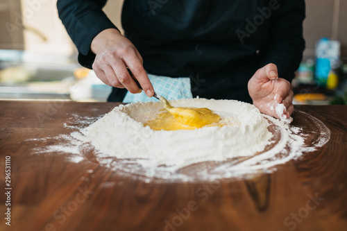 Chef making fresh pasta in the kitchen
