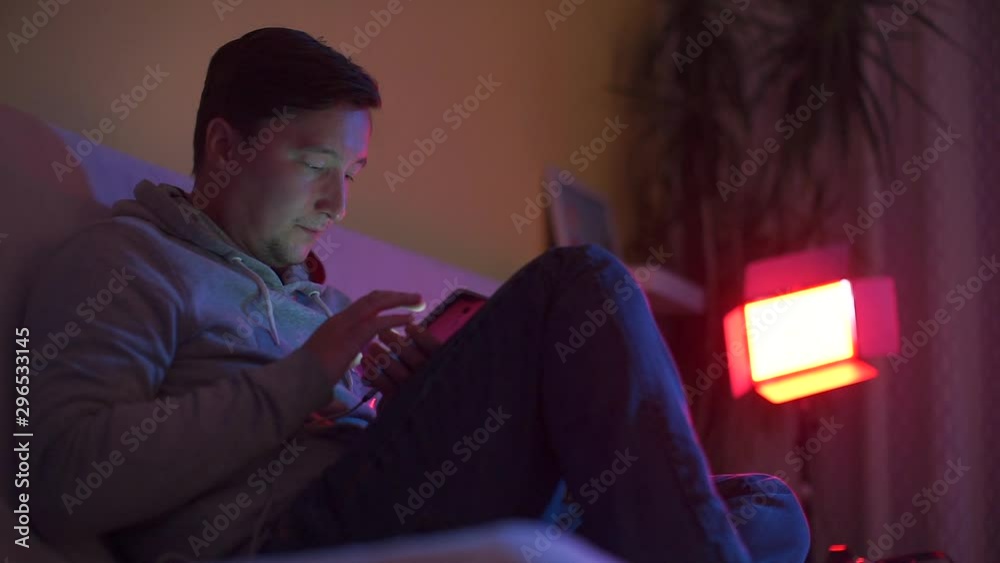 The guy at the club party uses a smartphone. The guy at the club party uses a smartphone.