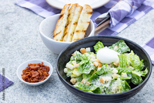  caesar salad vegetable in a bowl on table photo