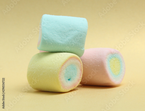 colorful marshmallows candy  on yellow background