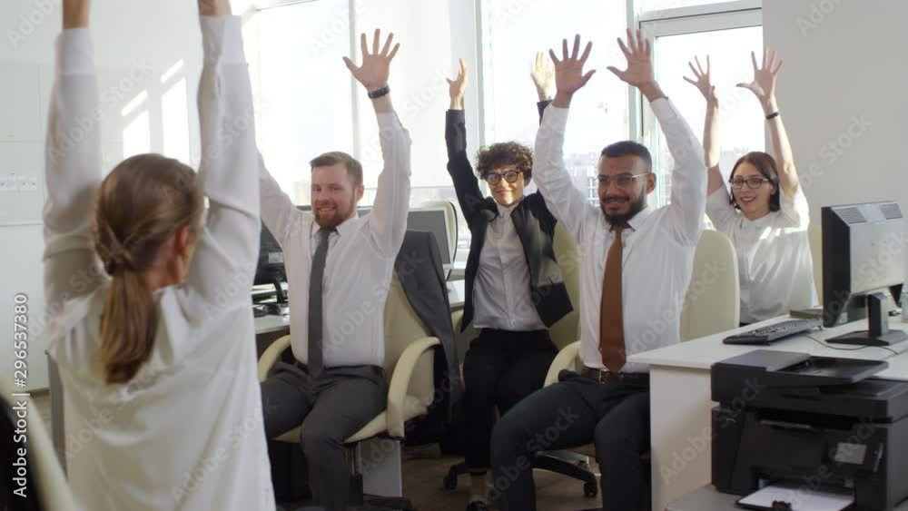 Lockdown of several multiethnic office workers doing exercises in office