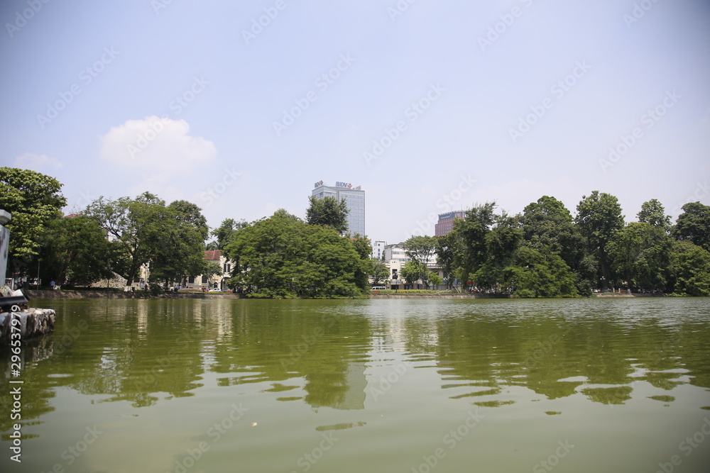 The city hides behind the trees of Lake Hanoi, Vietnam