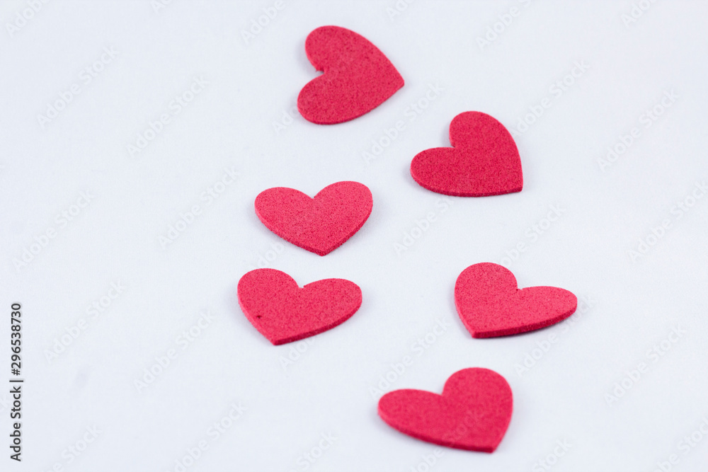 Red crafting foam hearts in white background. Decor hearts by cutting from red crafting foam Red crafting foam hearts in white background. Decor hearts by cutting from red crafting foam