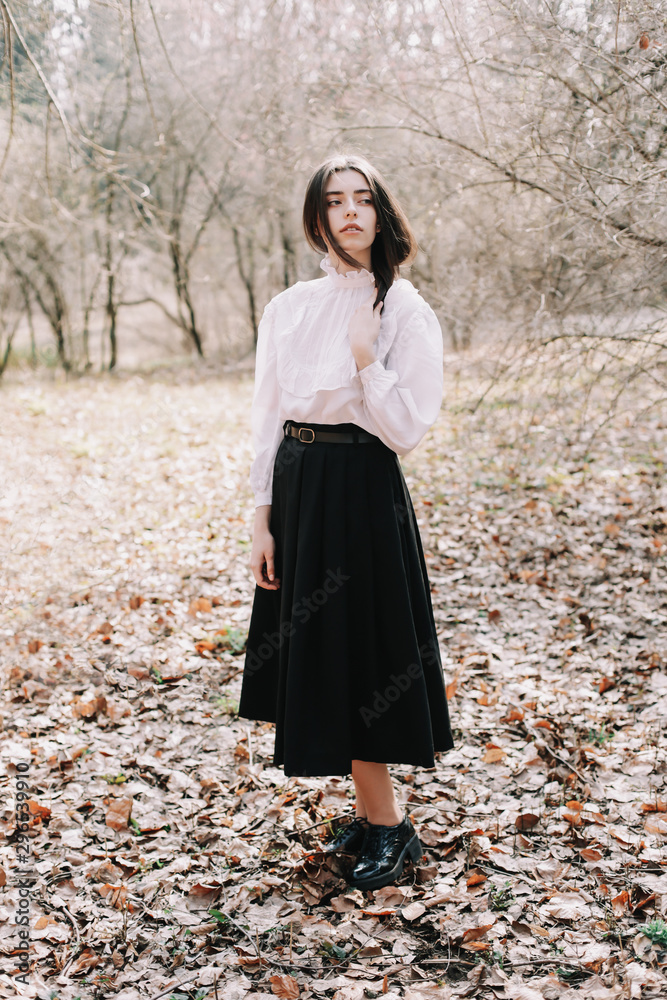Beautiful dreamy girl portrait. Romantic portrait of a beautiful girl in the park Beautiful dreamy girl portrait. Romantic portrait of a beautiful girl in the park