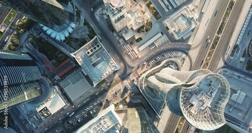 Down-looking aerial view of a global futuristic city, with skyscrapers, high rise towers and big avenues, circulation and cars, in Doha, the capital city of Qatar photo