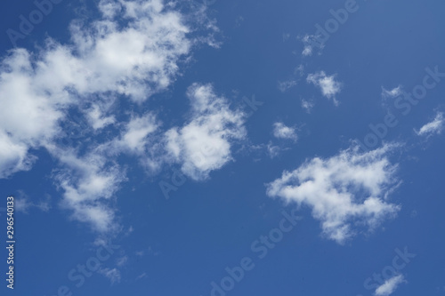 Large white fluffy clouds with a beautiful blue sky.