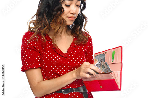 Asian woman putting money i...