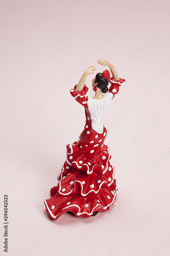 flamenco dancer figurine on a pop pink background