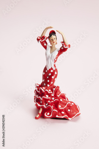 flamenco dancer figurine on a pop pink background