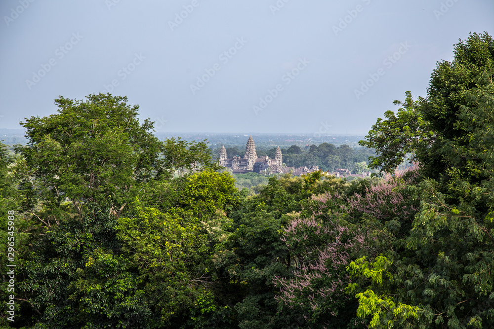 View of the temples of Angkor Wat from afar in the jungle, Cambodia