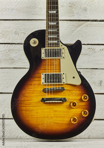 electric guitar shaped les paul on a white background