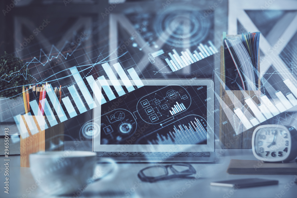 Financial market graph hologram and personal computer on background. Double exposure. Concept of forex. Financial market graph hologram and personal computer on background. Double exposure. Concept of forex.