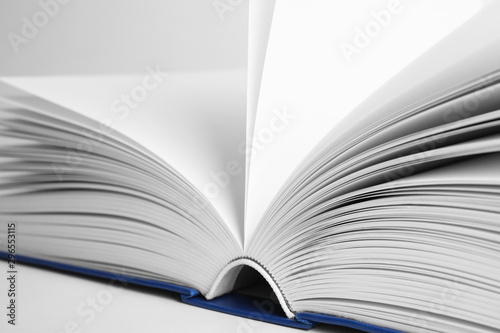 Closeup view of open book on white background