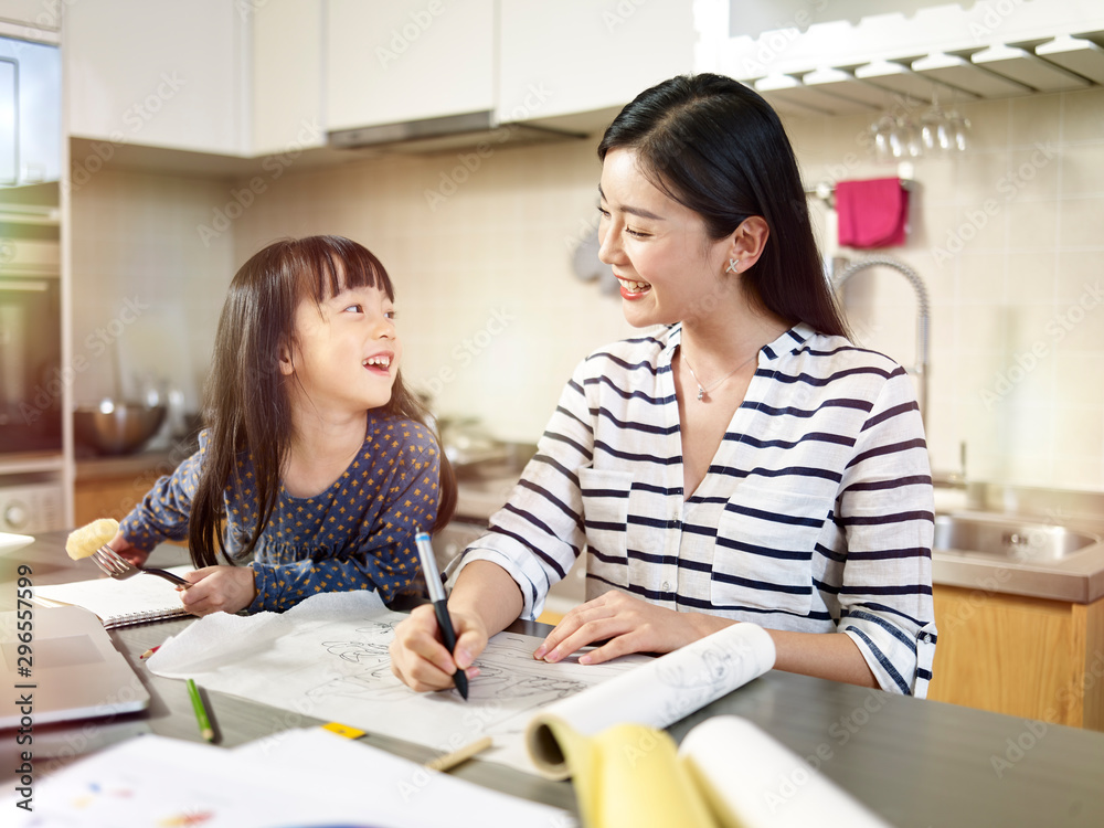 young asian mother enjoying working at home young asian mother enjoying working at home
