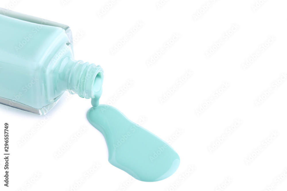 Nail polish splatter and bottle isolated on white background