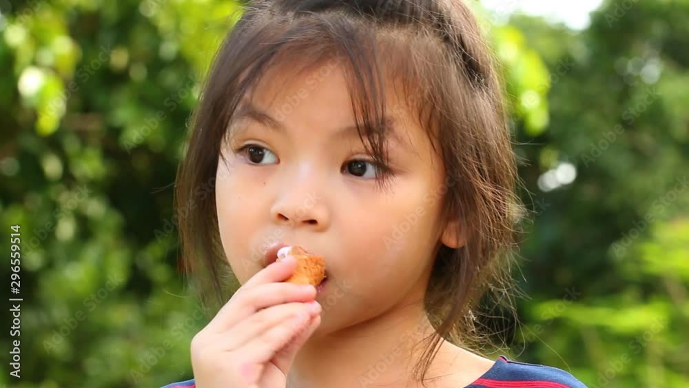 Thai child eating ice cream, outdoor Chiangmai Thailand Thai child eating ice cream, outdoor Chiangmai Thailand
