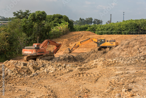 2 large excavators in earthwork construction photo