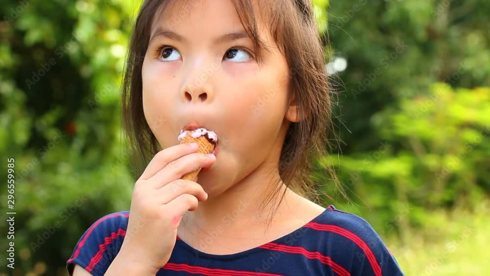 Thai child eating ice cream, outdoor Chiangmai Thailand Thai child eating ice cream, outdoor Chiangmai Thailand
