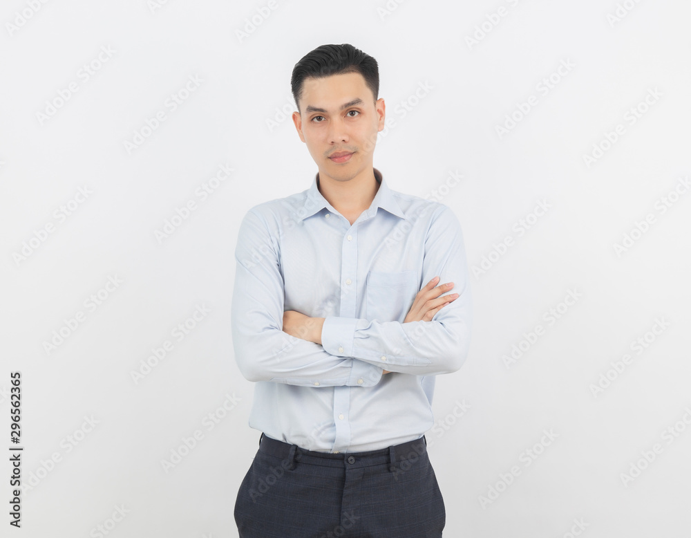 Young handsome asian business man looking to camera with arms crossed isolated on white background. Young handsome asian business man looking to camera with arms crossed isolated on white background.
