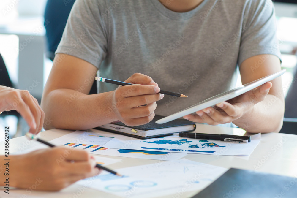 Young businesspeople discuss business and plan marketing strategies. Young businesspeople discuss business and plan marketing strategies.