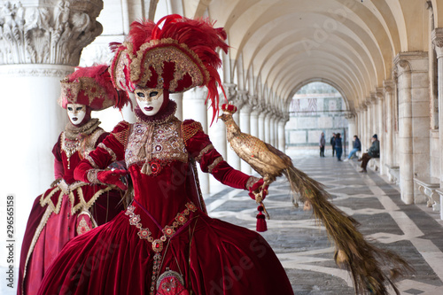 A pair of masks perform for the Venice carnival in Piazza San Marco. Italy. photo