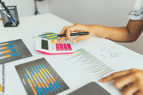 Business woman calculate about cost and doing finance at office, Finance managers task, Concept business and financial investment