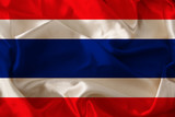 photo of the beautiful colored national flag of the modern state of Thailand on textured fabric, concept of tourism, emigration, economics and politics, closeup