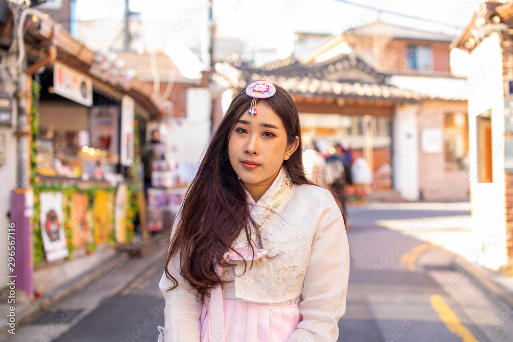 Fototapeta premium Korean women wearing korean traditional hanbok clothes at Bukchon Hanok Village in Seoul,South Korea.